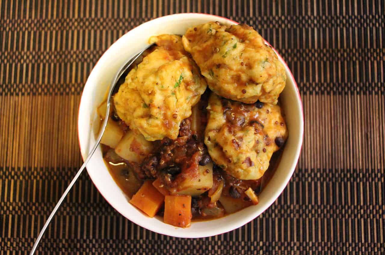 Black bean and quinoa stew with herby dumplings.