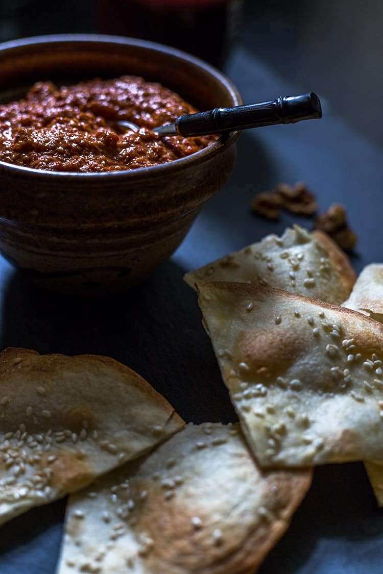 Muhammara red pepper and walnut dip, pictured with sesame crisps. Vegan and gluten free. 