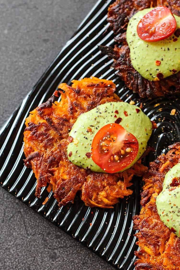 Crispy kumara cakes topped with green cashew sauce. 