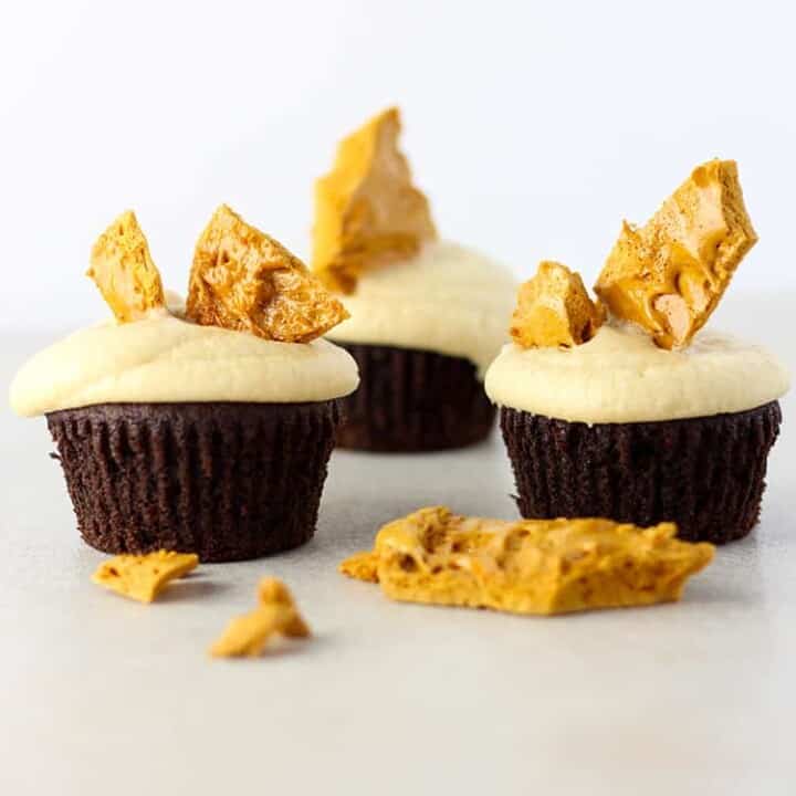 Chocolate cupcakes with caramel frosting and hokey pokey.