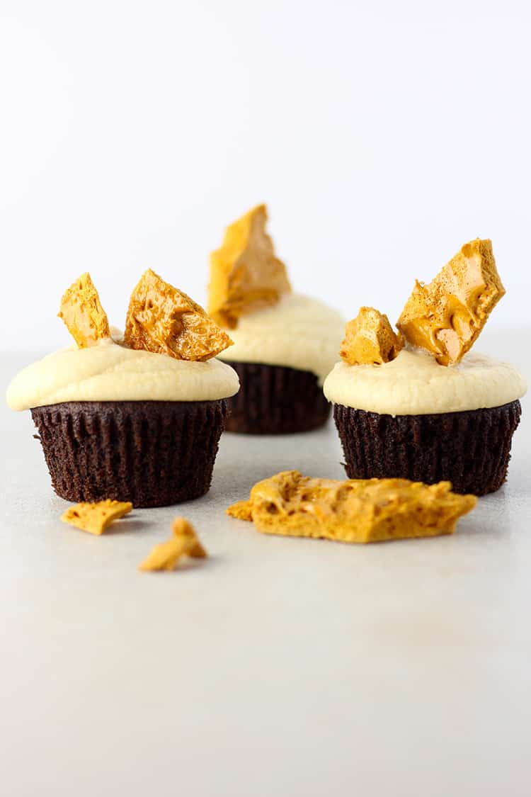 Chocolate cupcakes with caramel frosting and hokey pokey. 