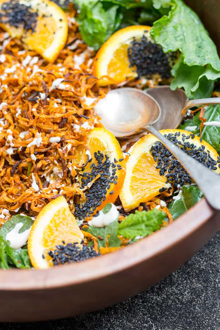 Spiralized sweet potato and kale salad with a creamy miso cashew dressing. 