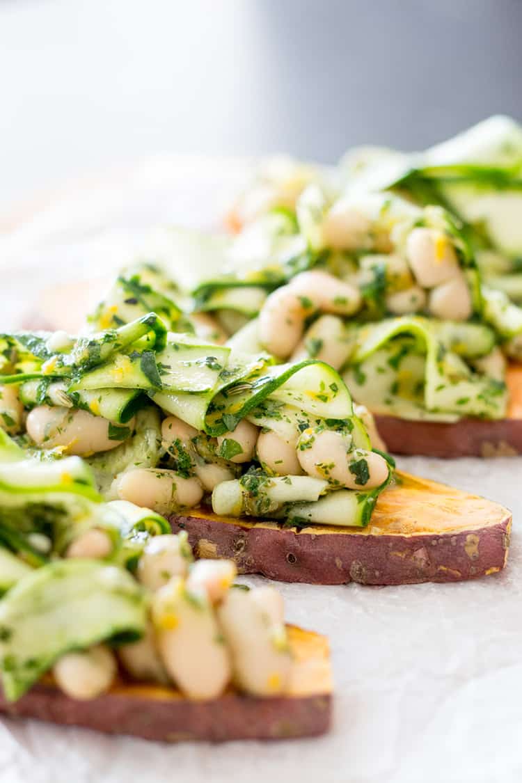 Sweet potato toast with herby cannellini beans and zucchini ribbons. 