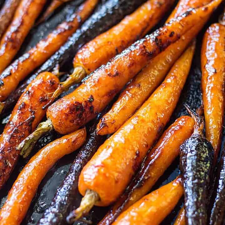 Gochujang maple glazed baby carrots fresh from the oven. A delicious vegan side dish (gluten free option).