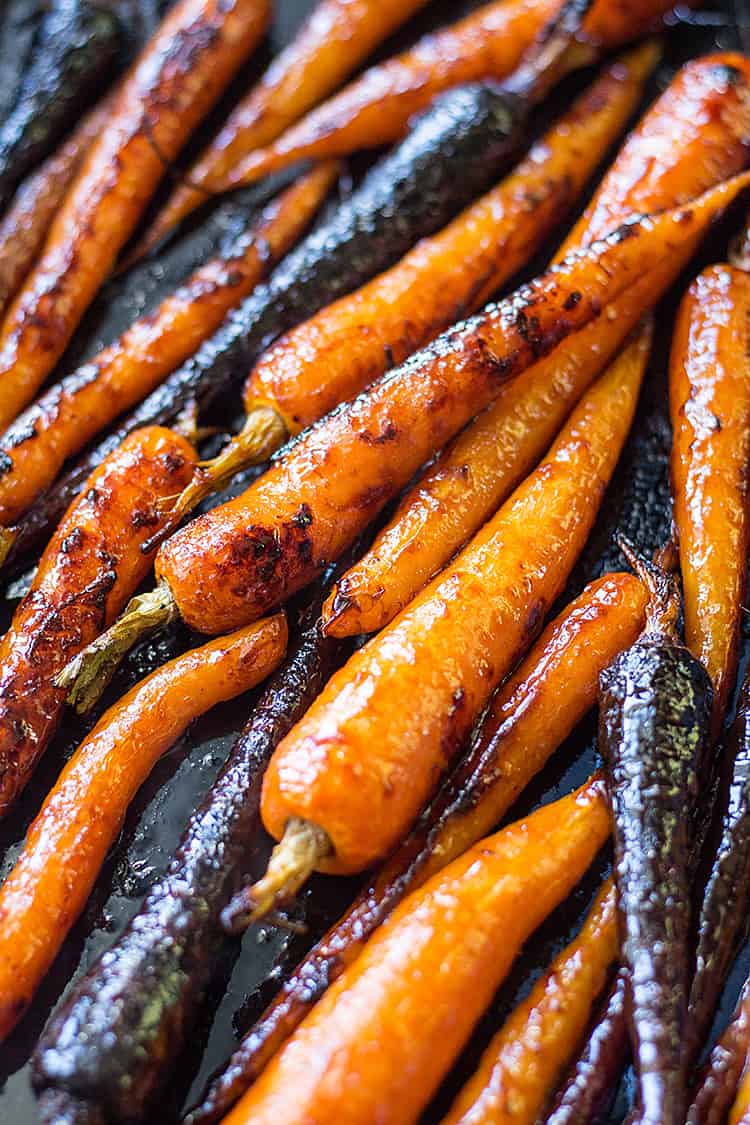 Gochujang maple glazed baby carrots fresh from the oven. A delicious vegan side dish (gluten free option). 
