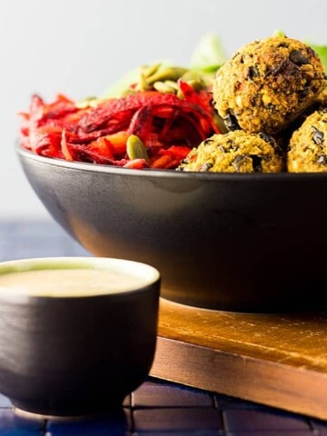 Vegan nourish bowl with beet salad and bean balls.