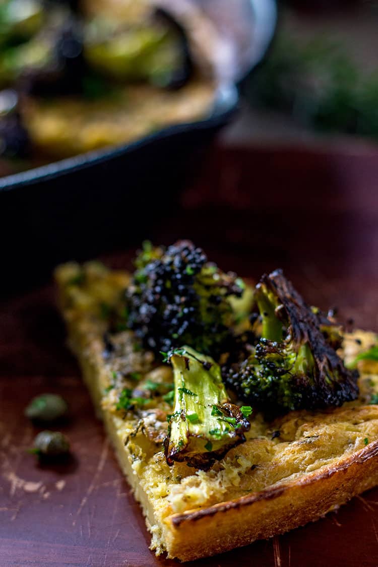 Farinata with charred broccoli, lemon and capers (vegan and gluten free).