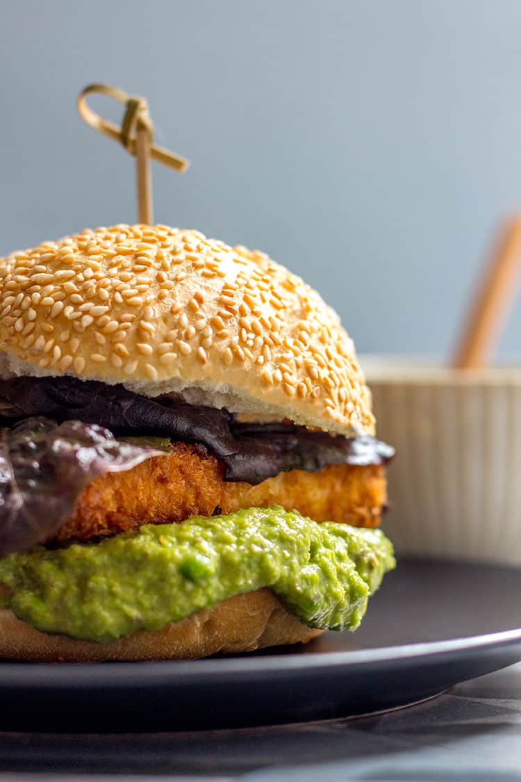 Thick slabs of crispy tofu nestled in a burger bun with a generous dollop of lemony green pea and caper mayo (vegan). 