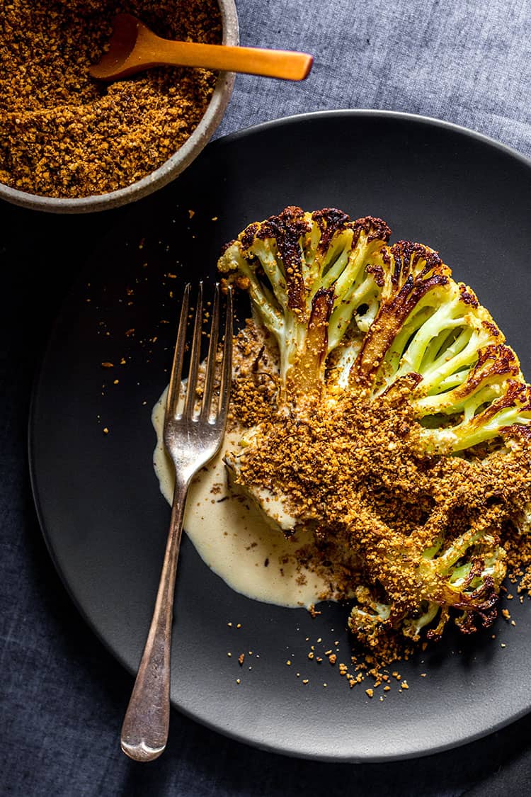 Cauliflower steak with orange tahini dressing and dukkah (vegan and gluten free). 