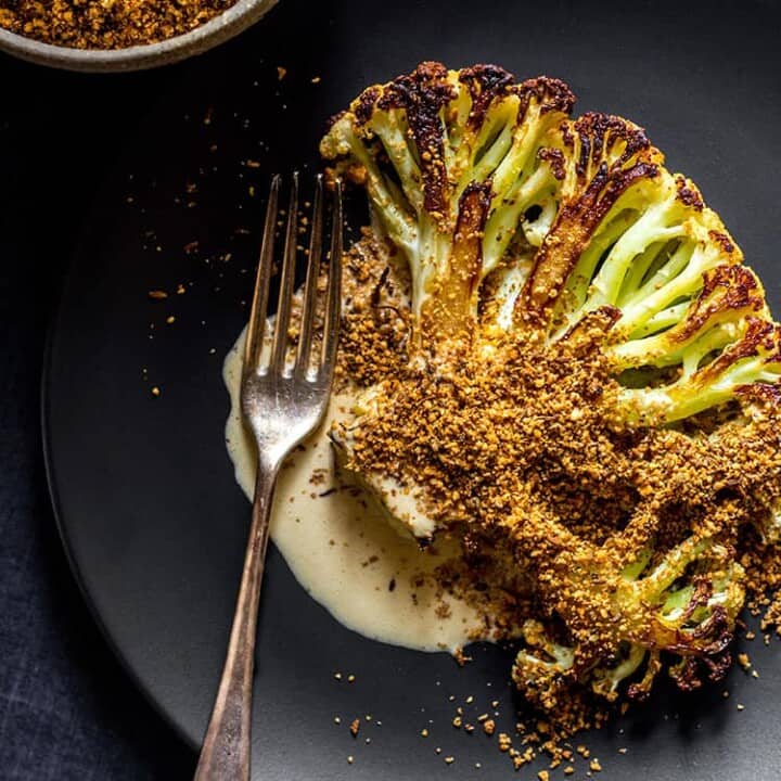 Cauliflower steak with orange tahini dressing and dukkah (vegan and gluten free).