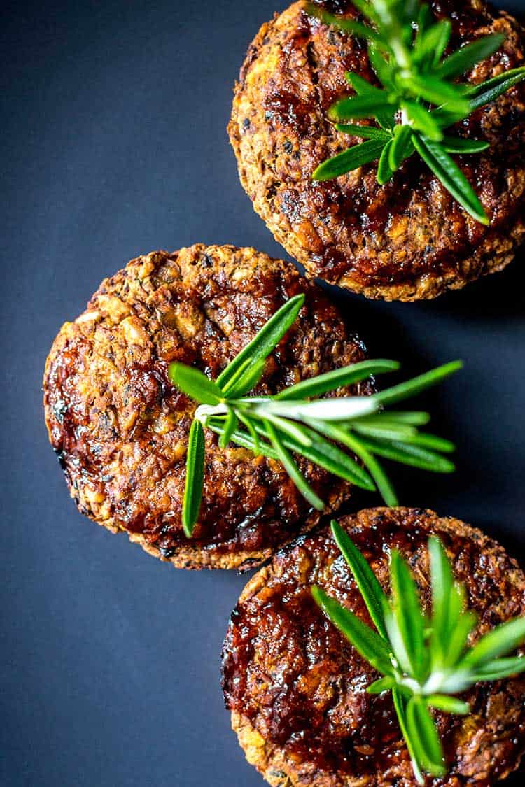 Overhead shot of little lentil loaves decorated with a sprig of rosemary (vegan and gluten free). 