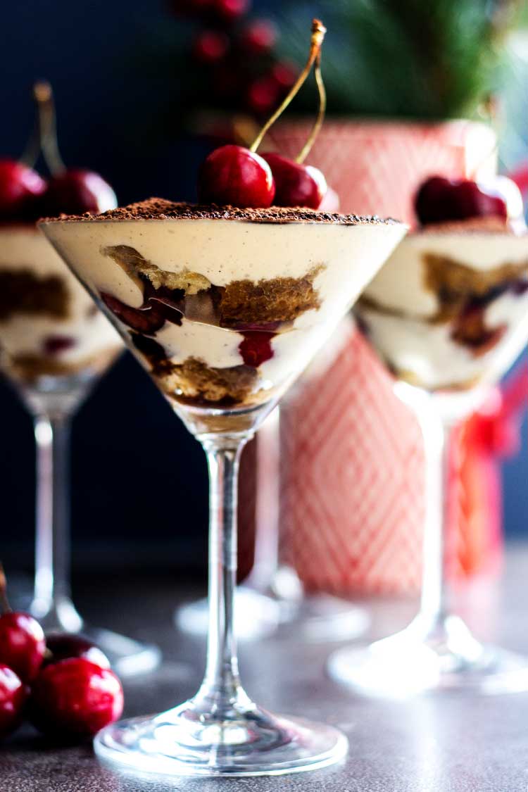 A close up shot of vegan tiramisu served in a martini glass. 