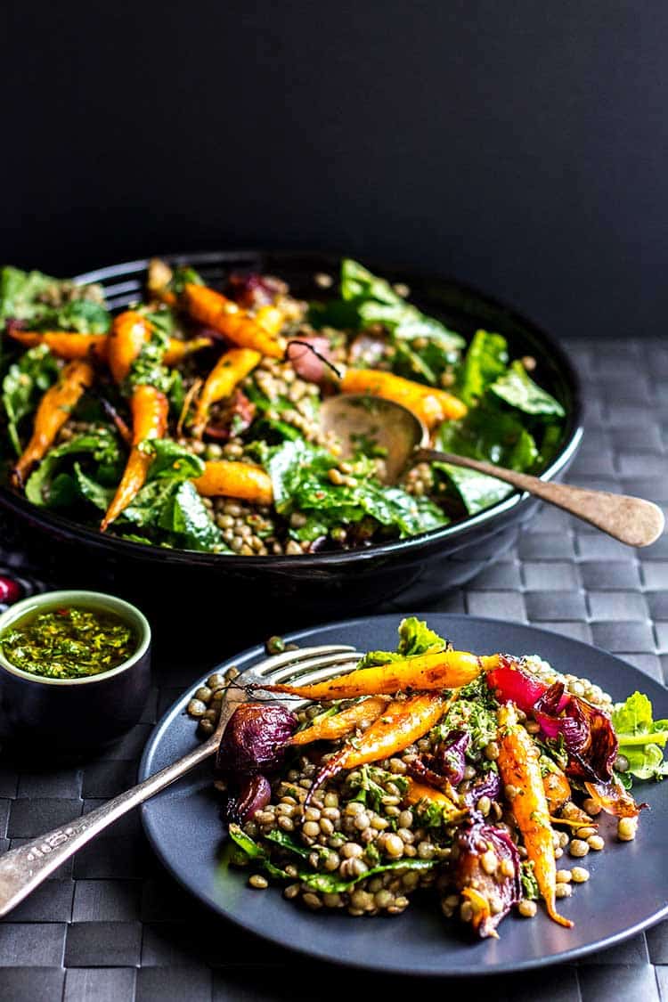 Lentil salad with roast baby carrots and red onions, dressed with chimichurri sauce (vegan and gluten free). 