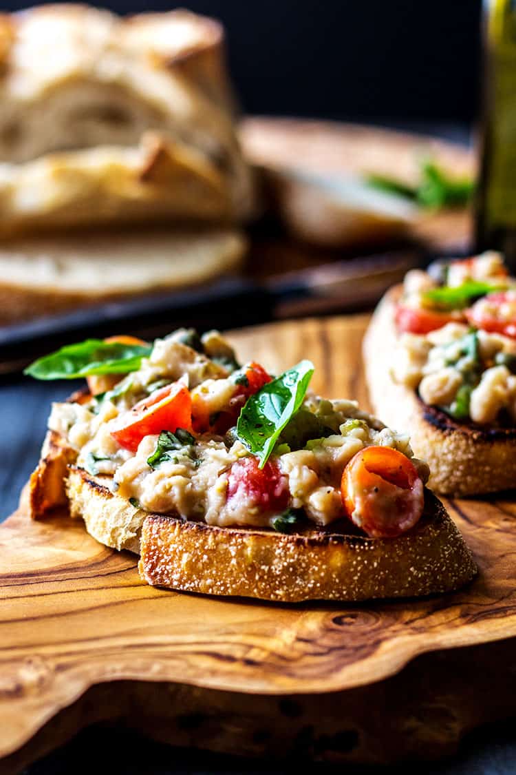 Cannellini bean and cherry tomato bruschetta (vegan).