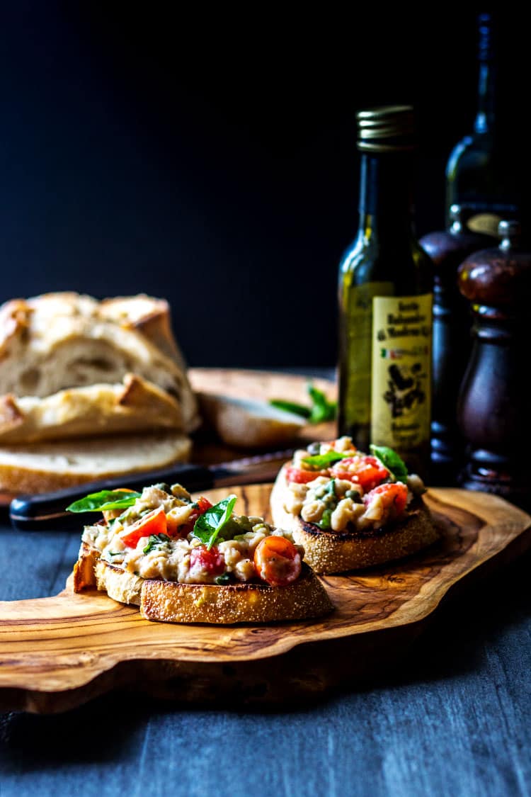 Cannellini bean and cherry tomato bruschetta (vegan). 