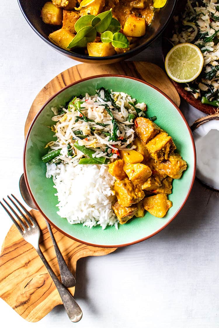 Balinese tempeh curry served with urab sayur (coconut and vegetable salad) and rice (vegan and gluten free). 