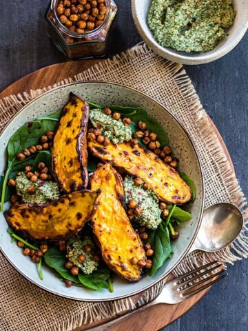 Baked sweet potato with crunchy chickpeas and parsley pesto.