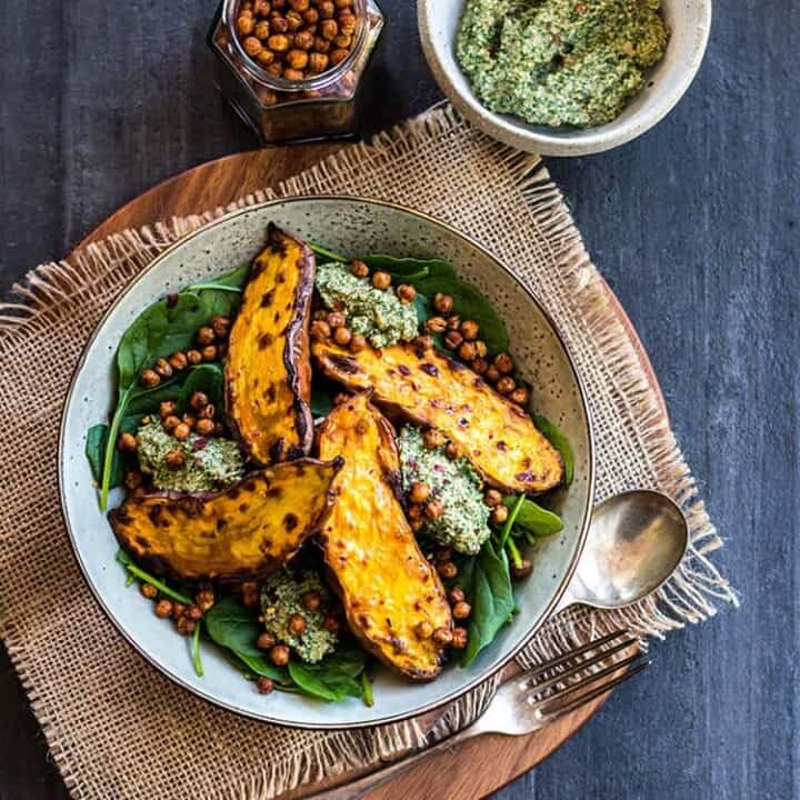 Baked sweet potato with crunchy chickpeas and parsley pesto.