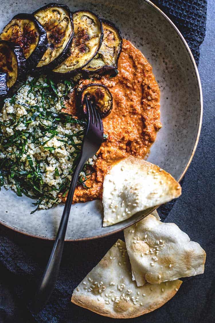 Quinoa, kale and eggplant bowl with muhammara (vegan and gluten free).