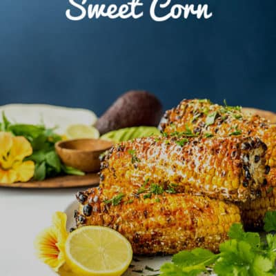 Inspired by Mexican street corn or elotes, this barbecue grilled sweet corn is smothered in mayo, spices and a vegan parmesan sprinkle. Vegan and gluten free.
