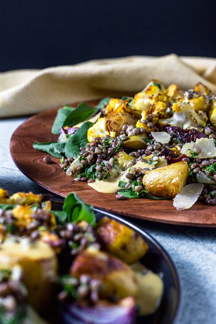 Potato, cauliflower and lentil salad with curry tahini dressing. 