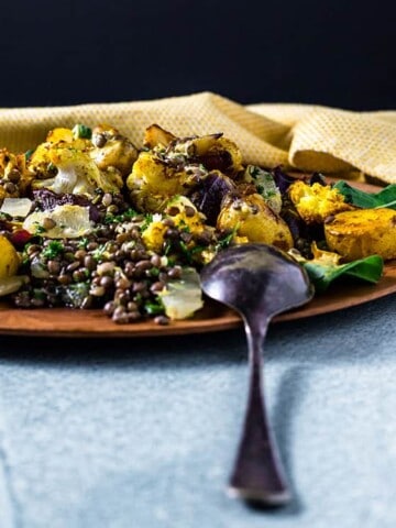 Potato, cauliflower and lentil salad with curry tahini dressing.
