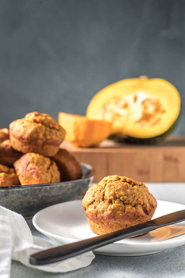 Vegan pumpkin, orange and chia seed muffins, on a plate and ready to serve. 