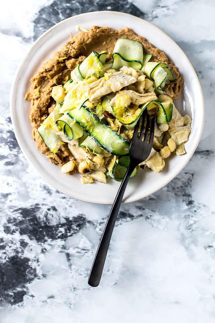 Zucchini, artichoke and macadamia salad with caramelised onion and butter bean puree.