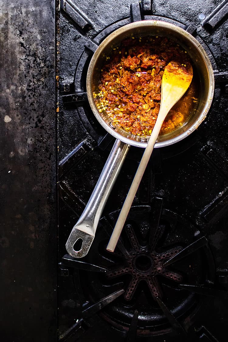 Tomato and garlic sauce being prepared in a saucepan. 