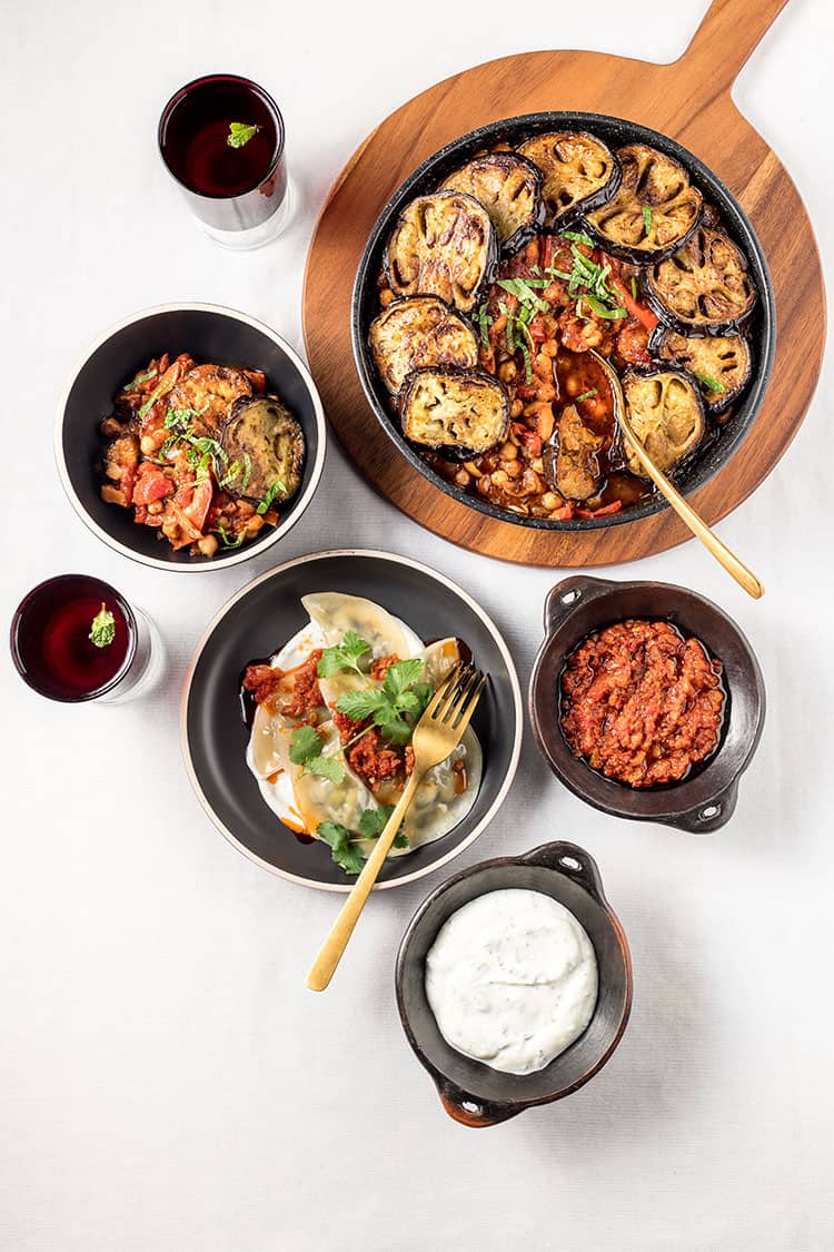 Ashak (Afghan vegetable dumplings) served alongside maghmour (eggplant and chickpea stew) for a sumptous Middle Eastern inspired feast. 